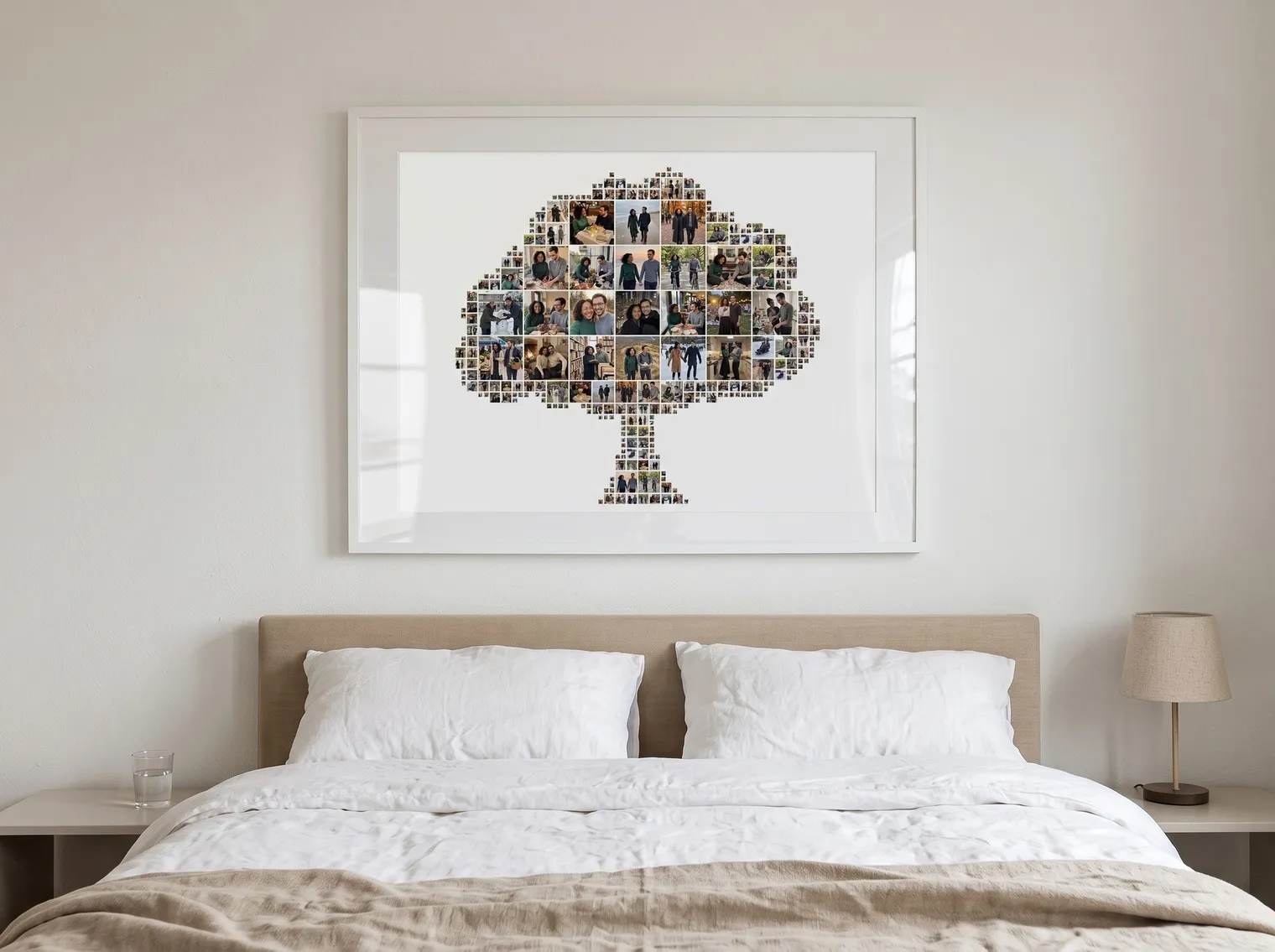 Tree-shaped photo collage framed with a wide white mat above a bed in a bright bedroom